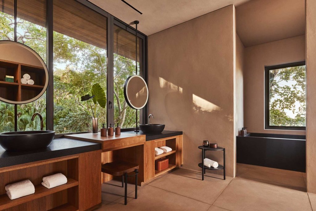 bathroom vanities look out wall of windows